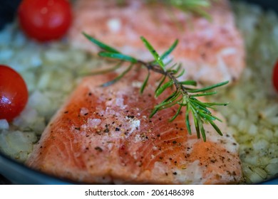 Fresh And Easy Cooking At Home - Grilled Salmon Filet In Olive Oil With Onions, Cherry Tomatoes And Rosemary