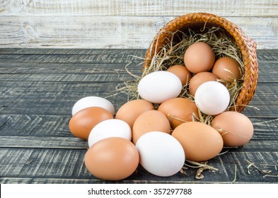 Fresh Egg And Duck Eggs On Wooden Background.