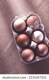 Fresh Eggs In A Cardboard Box, On A Beige Background, No People, Rustic Style, Selective Focus, Raw, Toned,sunlight,