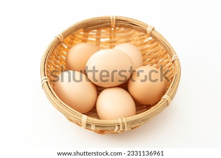 Fresh eggs served in a basket.