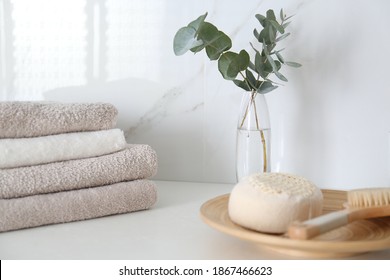 Fresh Eucalyptus Branches And Bathroom Items On Countertop