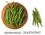 Fresh extra fine long green beans topped in a cane basket on white background