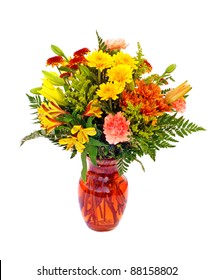 Fresh Fall Color Flower Arrangement In Orange Vase Isolated On White