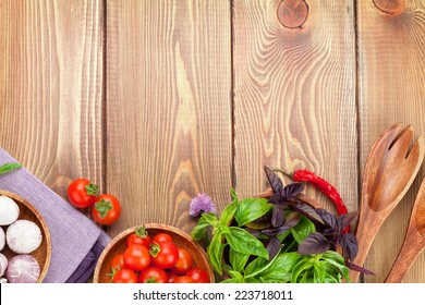 Fresh Farmers Tomatoes And Basil On Wood Table. View From Above With Copy Space