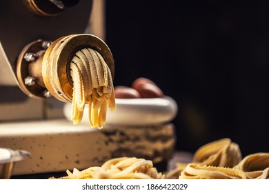 Fresh Fettuccine Pasta Leaving Pasta Making Machine.