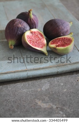 Similar – Frische Feigen auf violettem Hintergrund. Feigen in Scheiben geschnitten