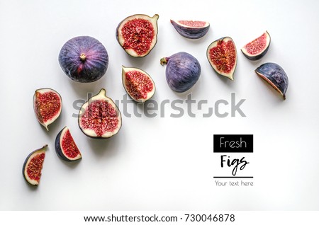 Fresh figs.Food Photo. Creative diagram of a whole and sliced â??â??figs on a white background with space for text. View from above. Copy space