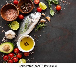 Fresh fish dorado. Dorado and ingredients for cooking on a table. - Shutterstock ID 1460588333