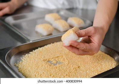 Fresh Fish Fillet Cube Being Placed Into Breadcrumbs,before Being Pan Fried.