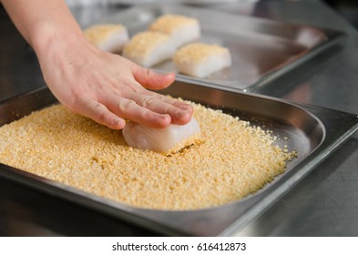 Fresh Fish Fillet Cube Being Placed Into Breadcrumbs,before Being Pan Fried.