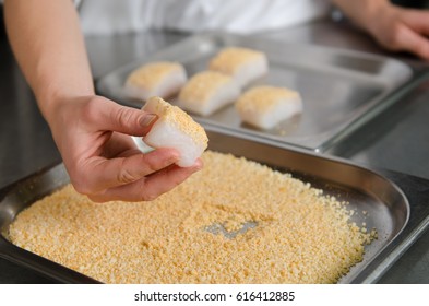 Fresh Fish Fillet Cube Being Placed Into Breadcrumbs,before Being Pan Fried.