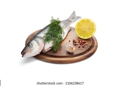 Fresh Fish Isolated On White Background, With Lemon, Herbs And Spices On Wooden Plate