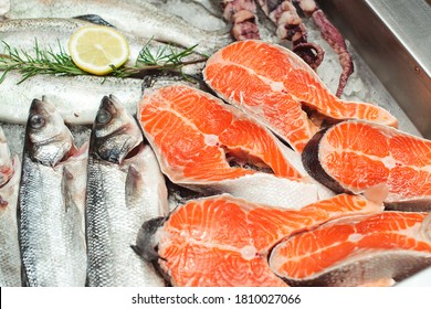 Fresh fish and seafood. Healthy eating concept. Top view. Showcase with chilled red fish in grocery store. Market place, showcase with sea food. Retail sale, marketplace.