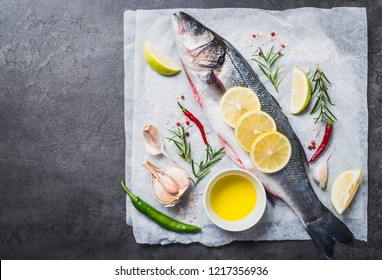 Fresh Fish And Spices On Black Slate Table.Top View With Copy Space.