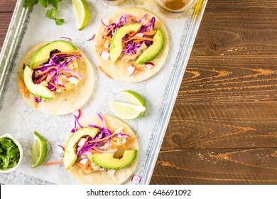 Fresh Fish Tacos With Cod And Purple Cabbage On A White Corn Tortillas.