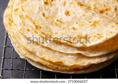 Fresh flatbread on a cooling rack. Close up.