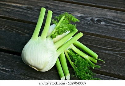 Fresh Florence fennel bulbs or Fennel bulb on wooden background.Healthy and benefits of Florence fennel bulbs.