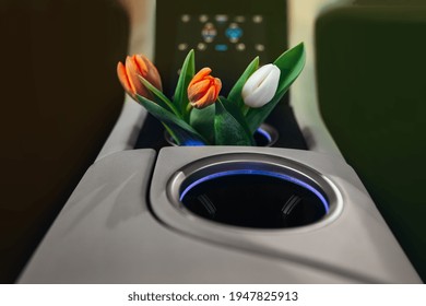 Fresh Flowers At The Car Cup Holder