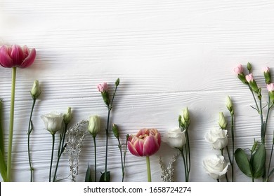 Fresh Flowers Pattern On White Wood Background. Tulips, Roses, Carnations. Top View. Space For Your Text. Nature Photography. Floral Template. For Your Banner, Greeting Card.