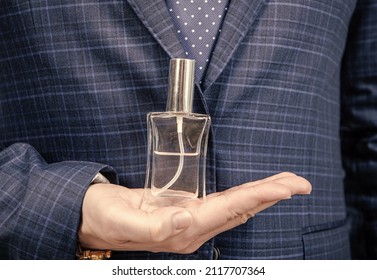 Fresh Fragrance For Everyday Use. Perfume Bottle On Male Hand. Perfume Spray. Eau De Toilette