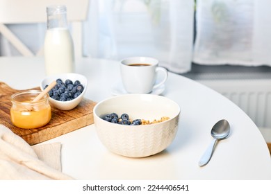 Fresh fragrant homemade granola made from oatmeal, honey and nuts. Balanced breakfast or snack - Shutterstock ID 2244406541
