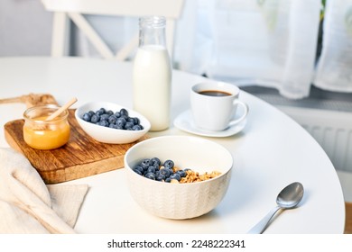 Fresh fragrant homemade granola made from oatmeal, honey and nuts. Balanced breakfast or snack - Shutterstock ID 2248222341