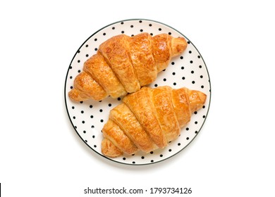 Fresh french croissants with chocolate on trendy white plate with black peas isolated on white background Continental morning breakfast Top view Flat lay   - Shutterstock ID 1793734126