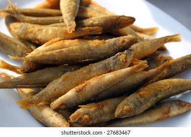 Fresh Fried European Anchovy On A White Plate