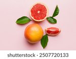 fresh Fruit grapefruit with Juicy grapefruit slices on colored background. Top view. Copy Space. creative summer concept. Half of citrus in minimal flat lay with copy space.