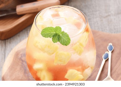 Fresh fruit ice containing pieces of papaya, pineapple and jicama with sweet and sour sauce - Shutterstock ID 2394921303