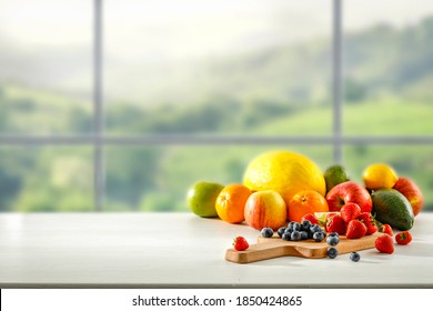 Fresh fruit in the kitchen on a wooden table by the sunny window - Shutterstock ID 1850424865