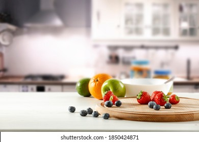 Fresh Fruit In The Kitchen On A Wooden Table By The Sunny Window