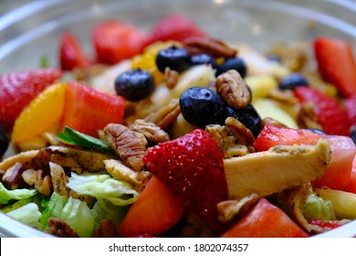 Fresh Fruit Salad In A Clear Plastic Bowl