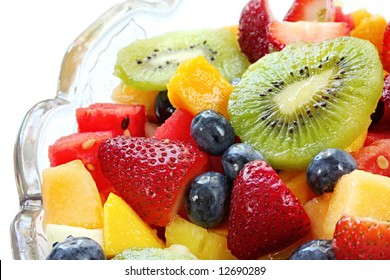 Fresh Fruit Salad In A Crystal Bowl.  Luscious Healthy Eating, With Kiwi Fruit, Strawberries, Blueberries, Canteloupe, Watermelon, Mango, Oranges, And Passionfruit