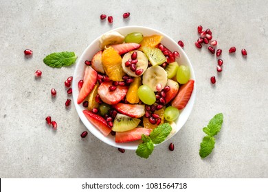 Fresh fruit salad on bright background, healthy diet concept - Powered by Shutterstock