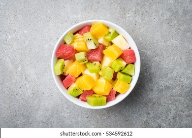 Fresh Fruit Salad On Gray Stone Table