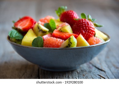 Fresh Fruit Salad With Strawberry, Pineapple, Kiwi, Ananas And  Mint.  Delicious Cut Fruit In A Bowl