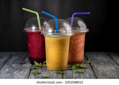 Fresh Fruit Smoothies On A Dark Background.Non Alcoholic Beverages