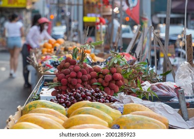 A Fresh Fruit Stand In Chinatown In New York City With Lychee Fruit And Cherries.