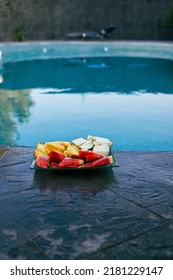 Fresh Fruit Tray On The Stamped Concrete Next To The Swimming Po