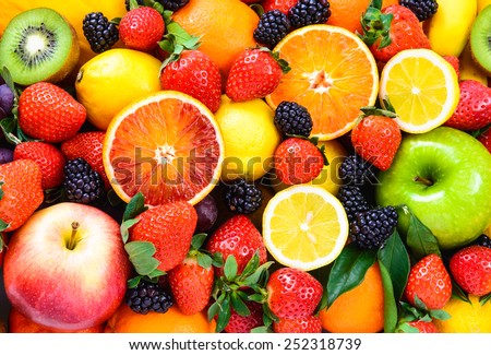 Fresh fruits background. Juicy fruits variety natural nutrition.