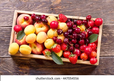 Fresh Fruits And Berries In Wooden Box, Top View