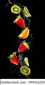 Fresh Fruits Falling In Water Splash Isolated On Black Background