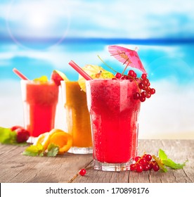 Fresh Fruits, Juice Drinks On A Beach 