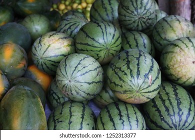 Fresh fruits. Melons, papaya and lime. Seen on a farmersmarket in Sri Lanka in Summer 2018. Canon eos 70 D