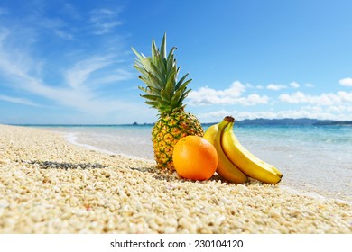 Fresh fruits on the sandy beach  - Powered by Shutterstock