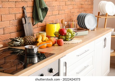 Fresh fruits on table in kitchen - Shutterstock ID 2022424373