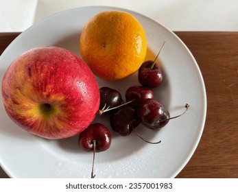 Fresh fruits on white plate photo for illustration, advertising, card