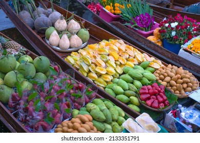 Fresh fruits on wooden boat at Damnoen Saduak Floating Market is the popular tourist attraction and travel destination of Ratchaburi, Thailand. Concept business trade on canals.