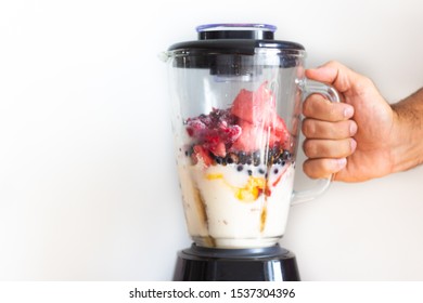 Fresh Fruits Smoothie Blender With Berries, Blueberries, Raspberries, Currants, Flattering Berries, Seeds, Mango, Peach, Avocado, Elderberry And Sesame Seeds. Smoothies Isolated With White Background